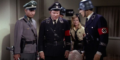 spock-and-kirk-wearing-nazi-uniforms-confront-a-white-haired-man-in-star-trek.jpg